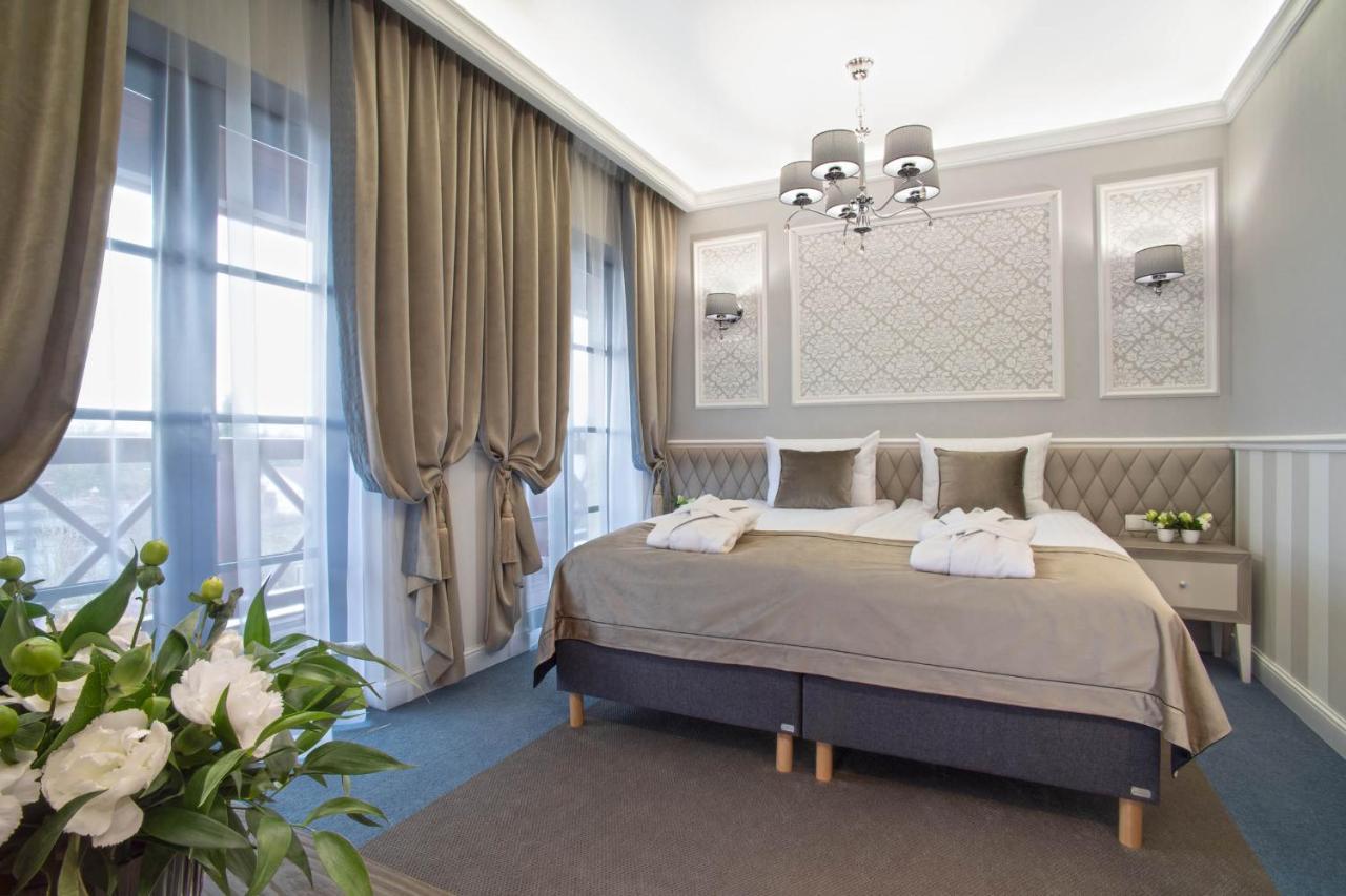 Boutique Odyseja & Spa Ciechocinek Εξωτερικό φωτογραφία A bedroom in the hotel