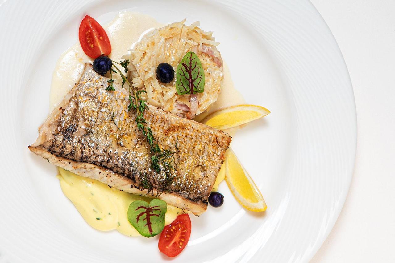 Boutique Odyseja & Spa Ciechocinek Εξωτερικό φωτογραφία A prepared dish of Arctic char